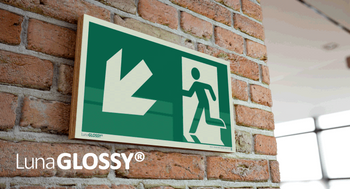 Znak Wyjście ewakuacyjne w lewo/dół (na sklejce)